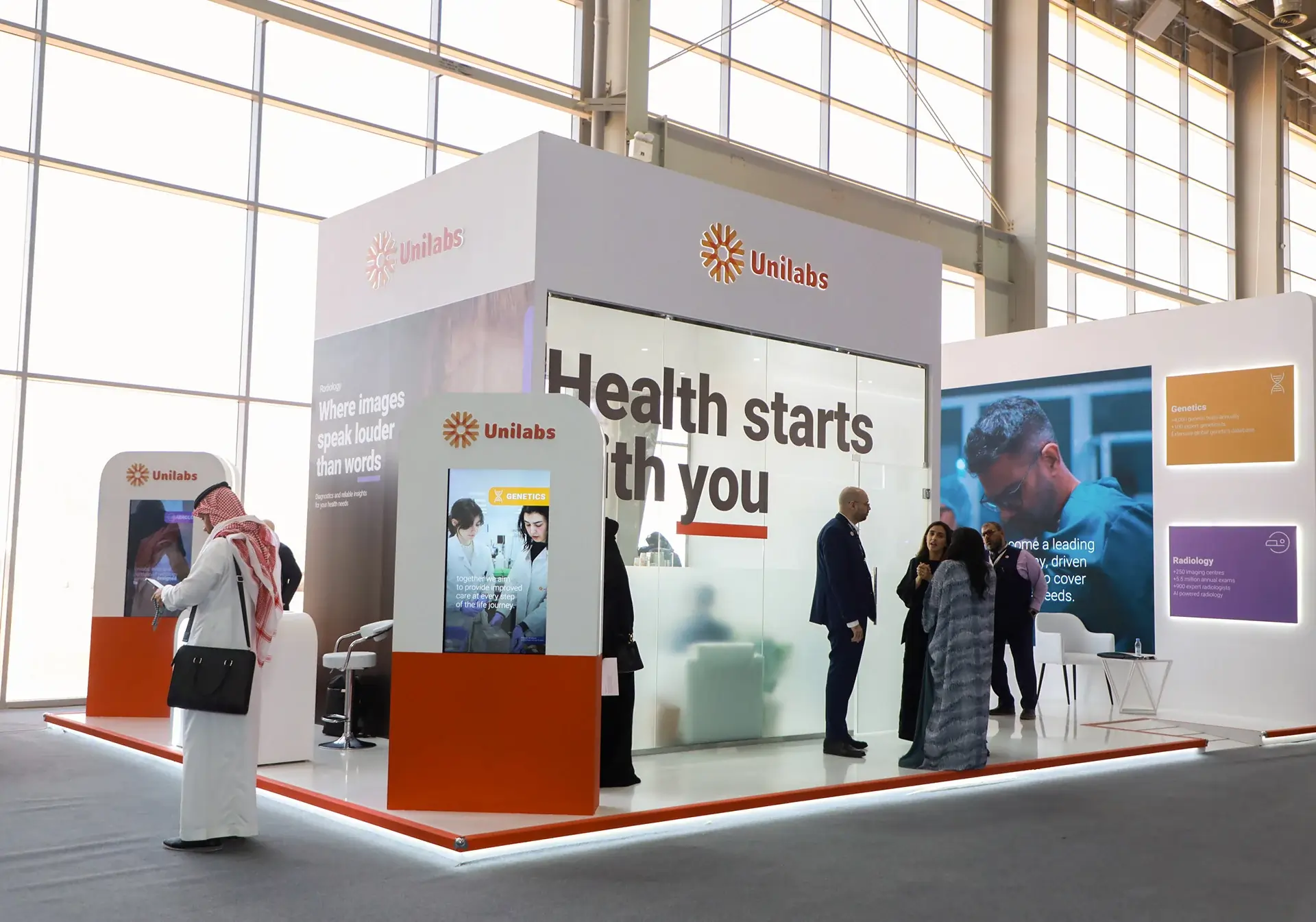 Creative exhibition stand design with double-deck booth and LED display at a busy trade show